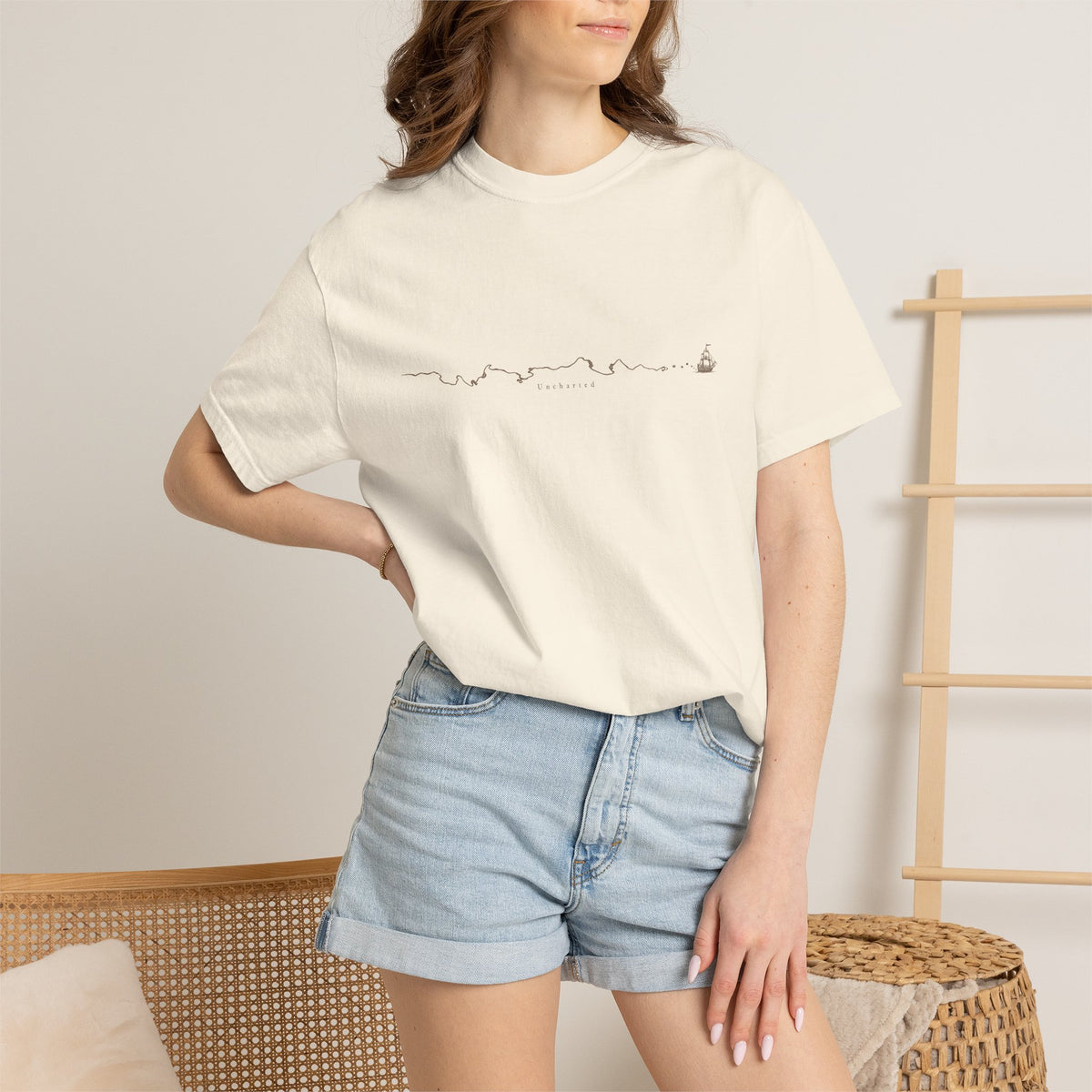 Uncharted t-shirt: fine-line panorama of paths, mountains and a ship