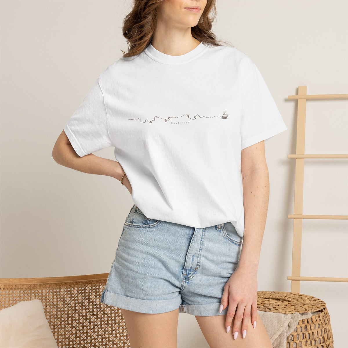 Uncharted t-shirt: fine-line panorama of paths, mountains and a ship